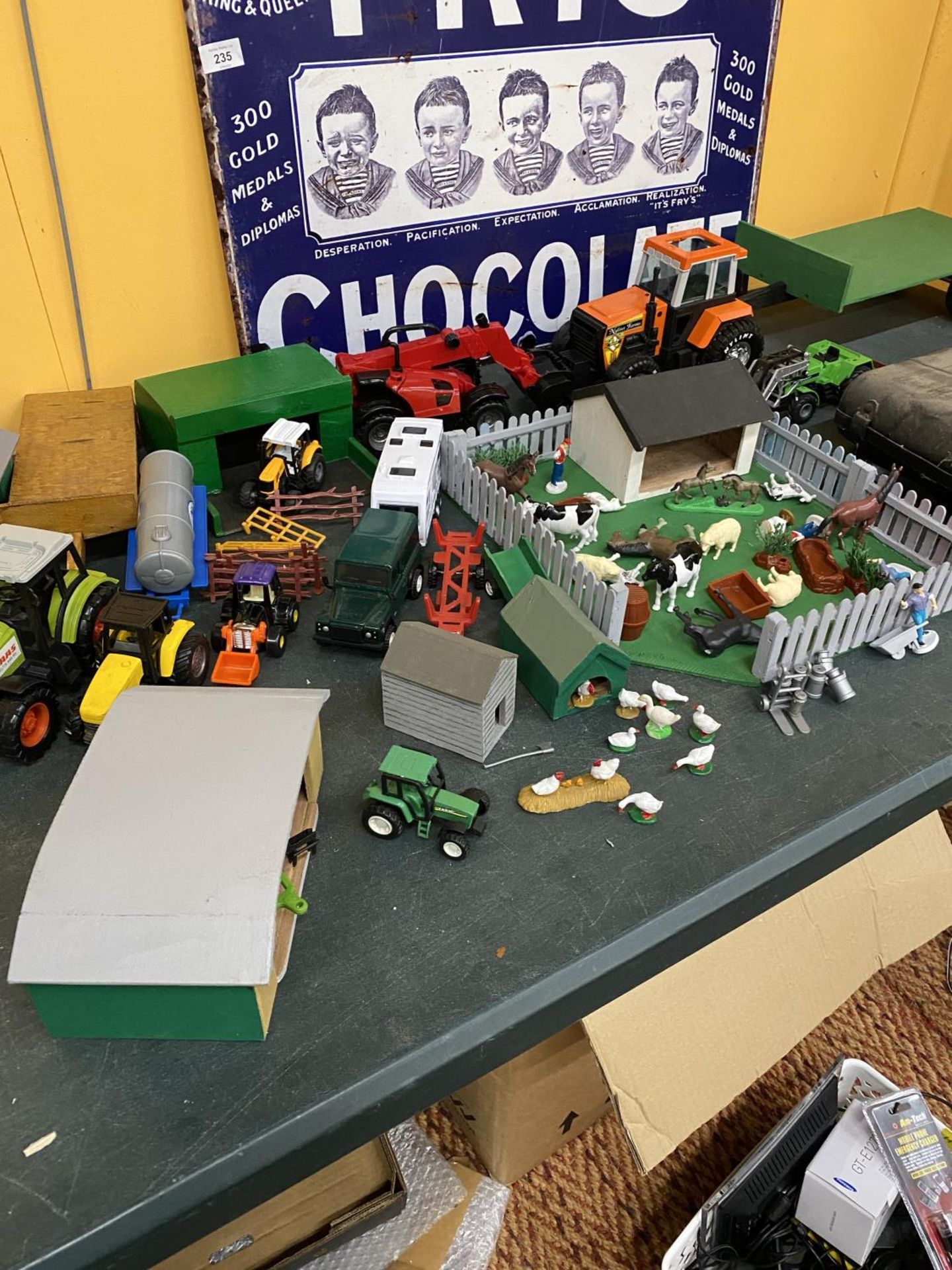 A TOY FARM LAYOUT PLUS A LARGE AMOUNT OF TOY MODELS AND SHEDS