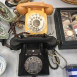 TWO VINTAGE TELEPHONES TO INCLUDE A BLACK 'CALL EXCHANGE' WITH DRAWER AND AN ORANGE ONE