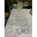 A QUANTITY OF GLASSES TO INCLUDE A WATER JUG AND TUMBLERS OF ALL SIZES