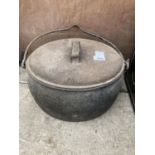 A LARGE VINTAGE CAST IRON COOKING POT