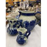 FOUR PIECES OF FLOW BLUE POTTERY TO INCLUDE THREE JUGS AND A CHEESE DISH