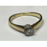 A 9 CARAT GOLD RING WITH A DIAMOND SOLITAIRE SIZE M