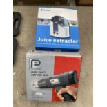 A DELTA ELECTRIC JUICE EXTRACTOR AND A PRO HOT AIR GUN