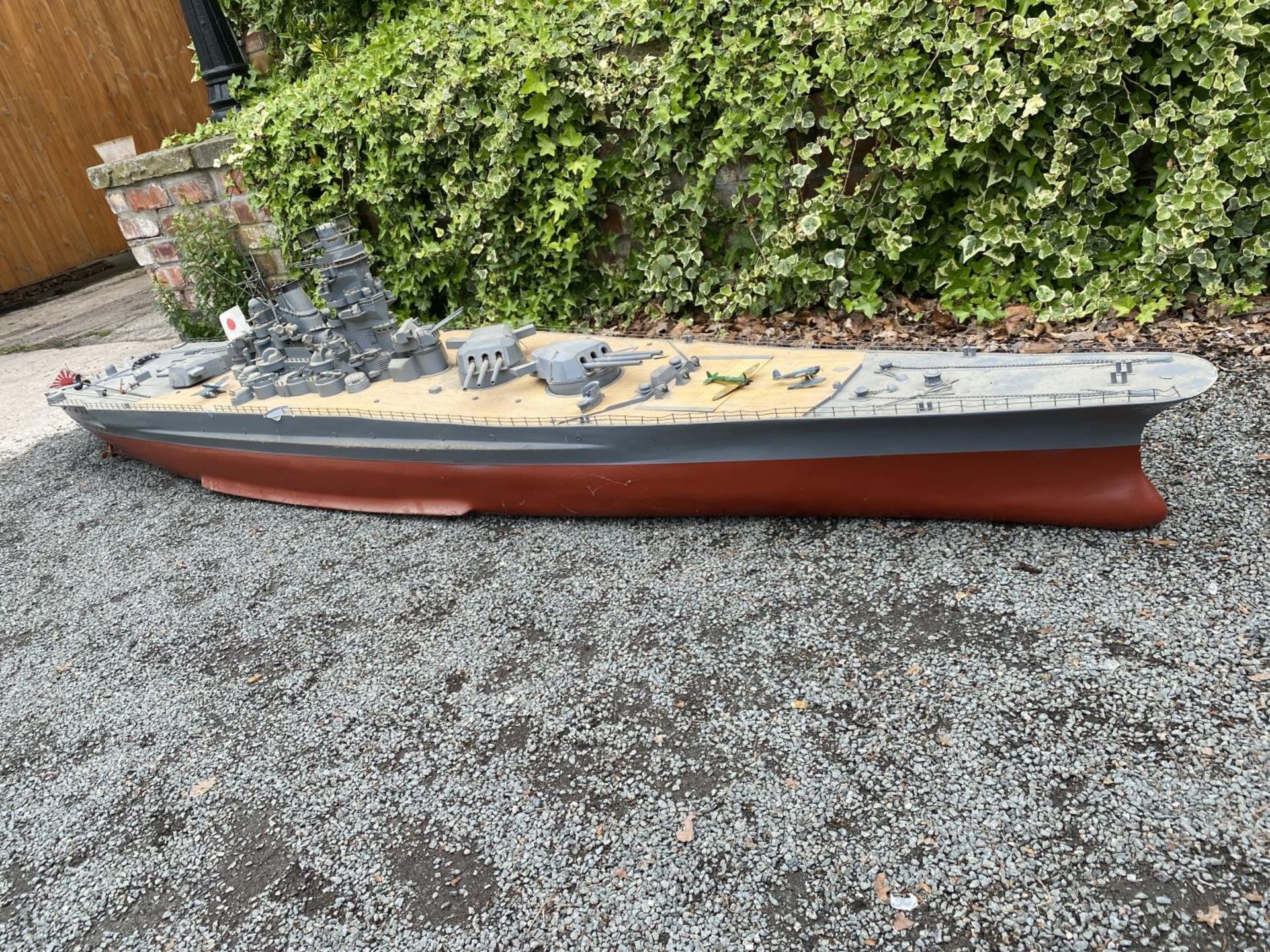 A VERY LARGE MOTORISED REMOTE CONTROLLED MODEL OF WWII JAPANESE MUSASHI / YAMATO WAR SHIP WITH