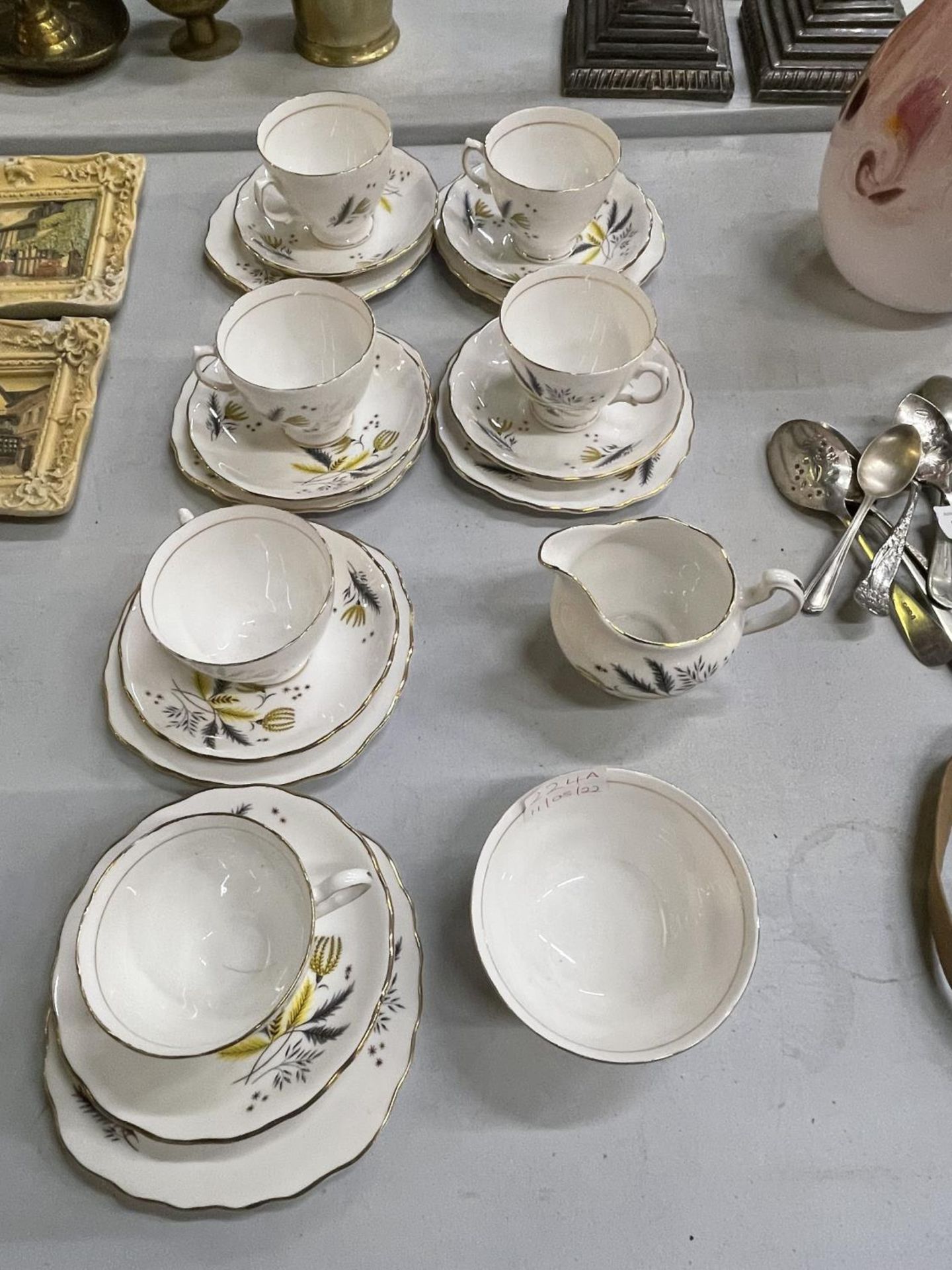 SIX COLCLOUGH TRIOS, CREAM JUG AND A SUGAR BOWL