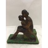 AN ART DECO STYLE BRONZED FIGURINE OF A MOTHER AND CHILD ON A BASE HEIGHT 28CM LENGTH 27CM