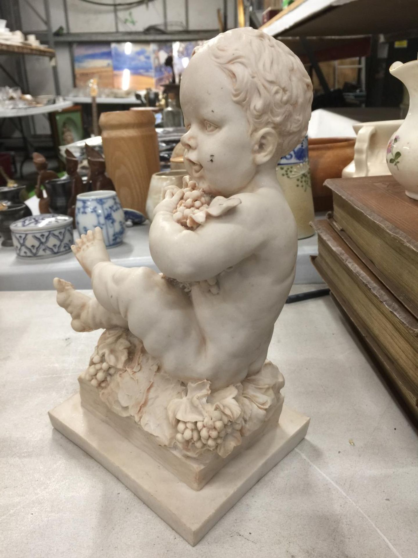 A STATUETTE OF A CHILD WITH GRAPES HEIGHT 26CM - Image 2 of 4