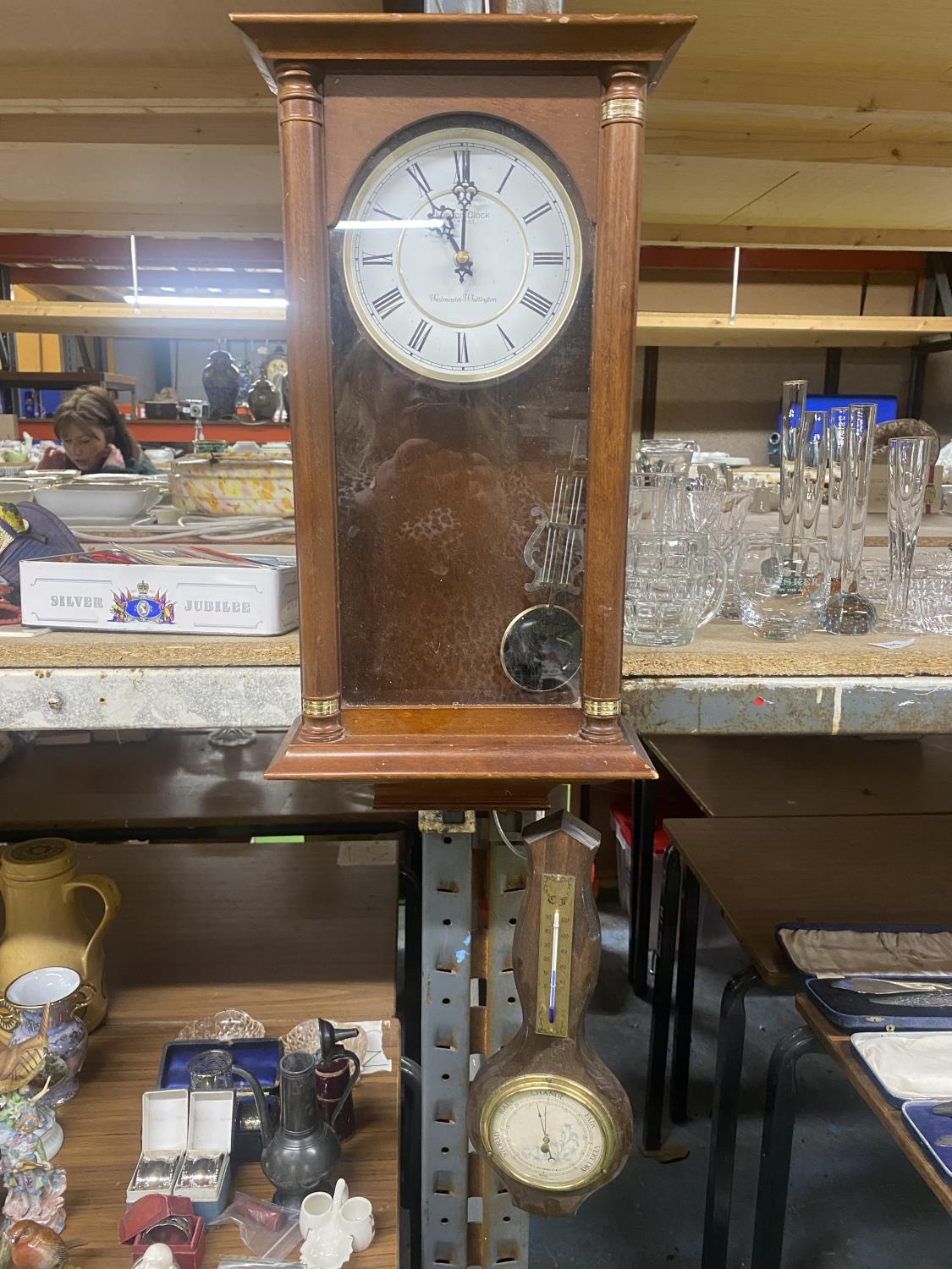 A MAHOGANY CASED WESTMINSTER-WHITTINGTON WALL CLOCK AND A BAROMETER
