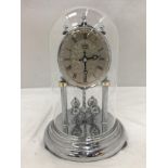 A GLASS DOMED MANTLE CLOCK