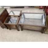 A PAIR OF GLASS TOPPED LAMP TABLES AND A MATCHING COFFEE TABLE