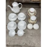 AN ASSORTMENT OF CERAMICS TO INCLUDE TRIOS AND A COFFEE POT