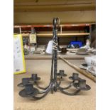 A PAIR OF WALL MOUNTED METAL CANDLESTICKS