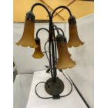 AN ART DECO STYLE TABLE LAMP WITH SIX FLUTED AMBER COLOURED GLASS SHADES