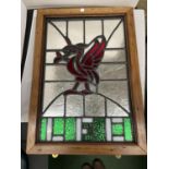 AN OAK FRAMED LEADED STAINED GLASS WINDOW PANEL DEPICTING LIVERPOOL FOOTBALL CLUB 50CM X 70CM