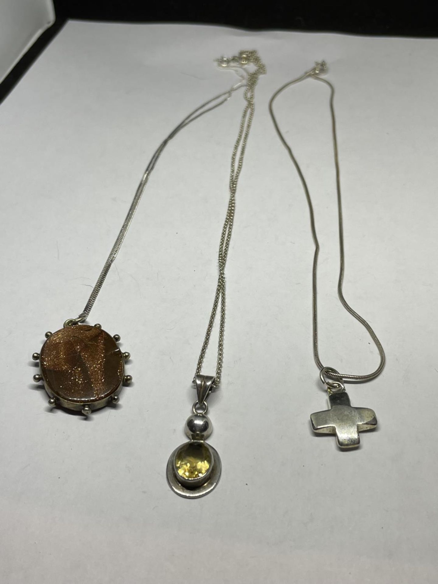 THREE MARKED SILVER NECKLACES AND PENDANTS