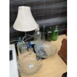 AN ASSORTMENT OF MAINLY GLASS ITEMS TO INCLUDE A SODA SIPHON, GLASS BOWLS AND COLOURED GLASS BOTTLES
