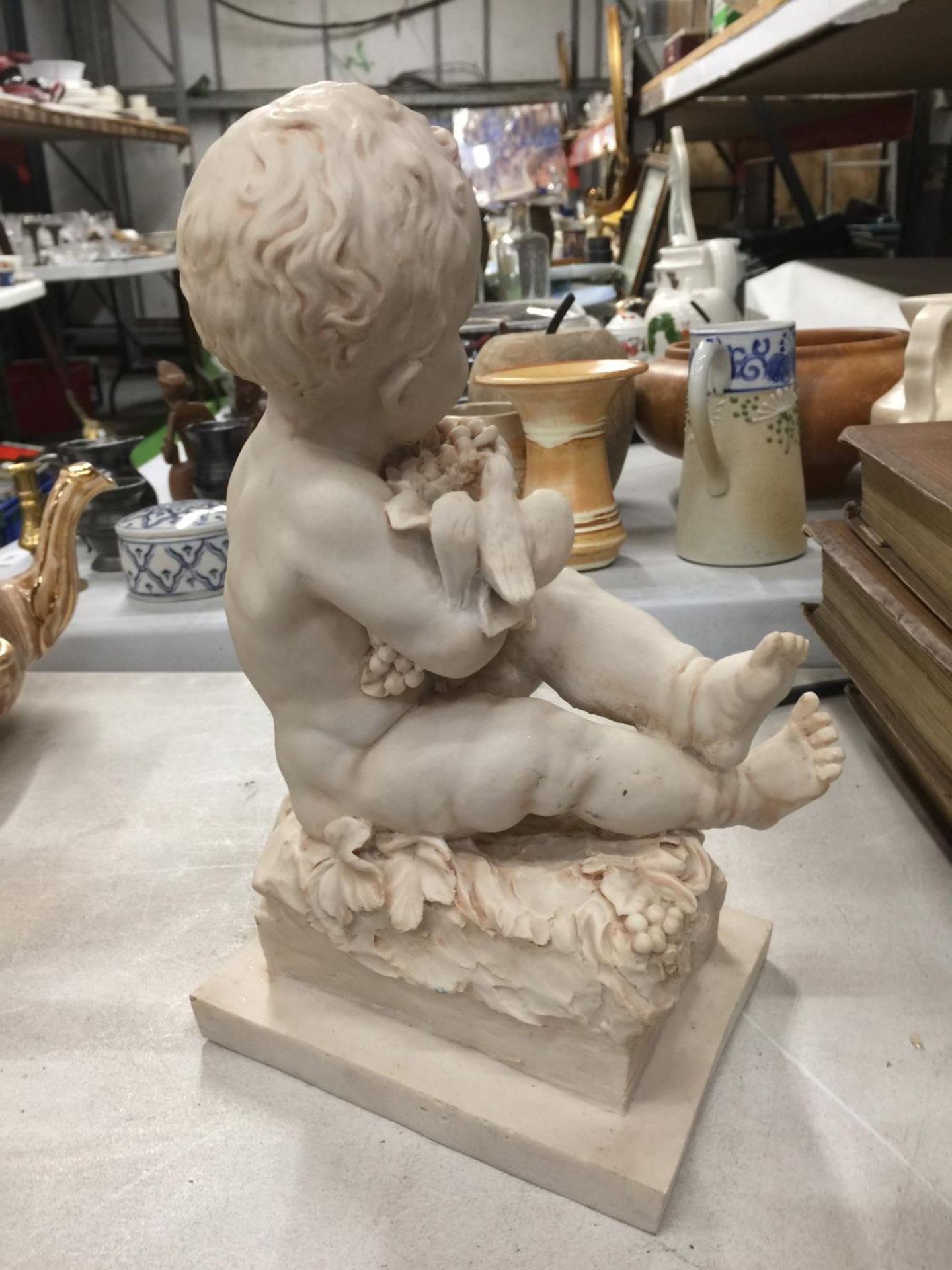 A STATUETTE OF A CHILD WITH GRAPES HEIGHT 26CM - Image 3 of 4