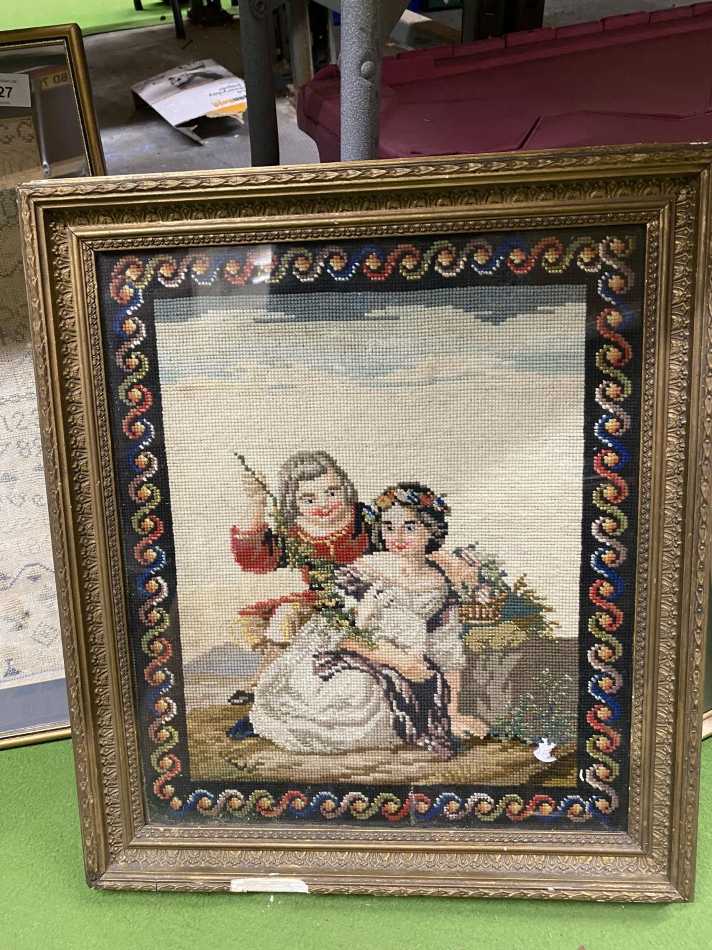 A VINTAGE FRAMED TAPESTRY OF A COURTING COUPLE