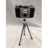 A VINTAGE KODAK COLORSNAP 35 ON AN ADJUSTABLE METAL TRIPOD