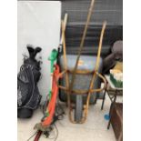 AN ASSORTMENT OF GARDEN ITEMS TO INCLUDE A WHEEL BARROW, A LEAF RAKE AND TWO ELECTRIC STRIMMERS ETC
