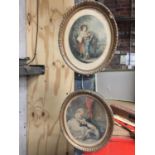 TWO OVAL GILT FRAMED PRINTS, ONE 'THE WOOD GATHERERS' THE OTHER A MAN AND WOMEN