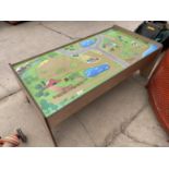 A WOODEN CHILDRENS PLAY TABLE