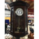 A MAHOGANY CASED WALL CLOCK WITH GLASS PANELS HEIGHT 68CM