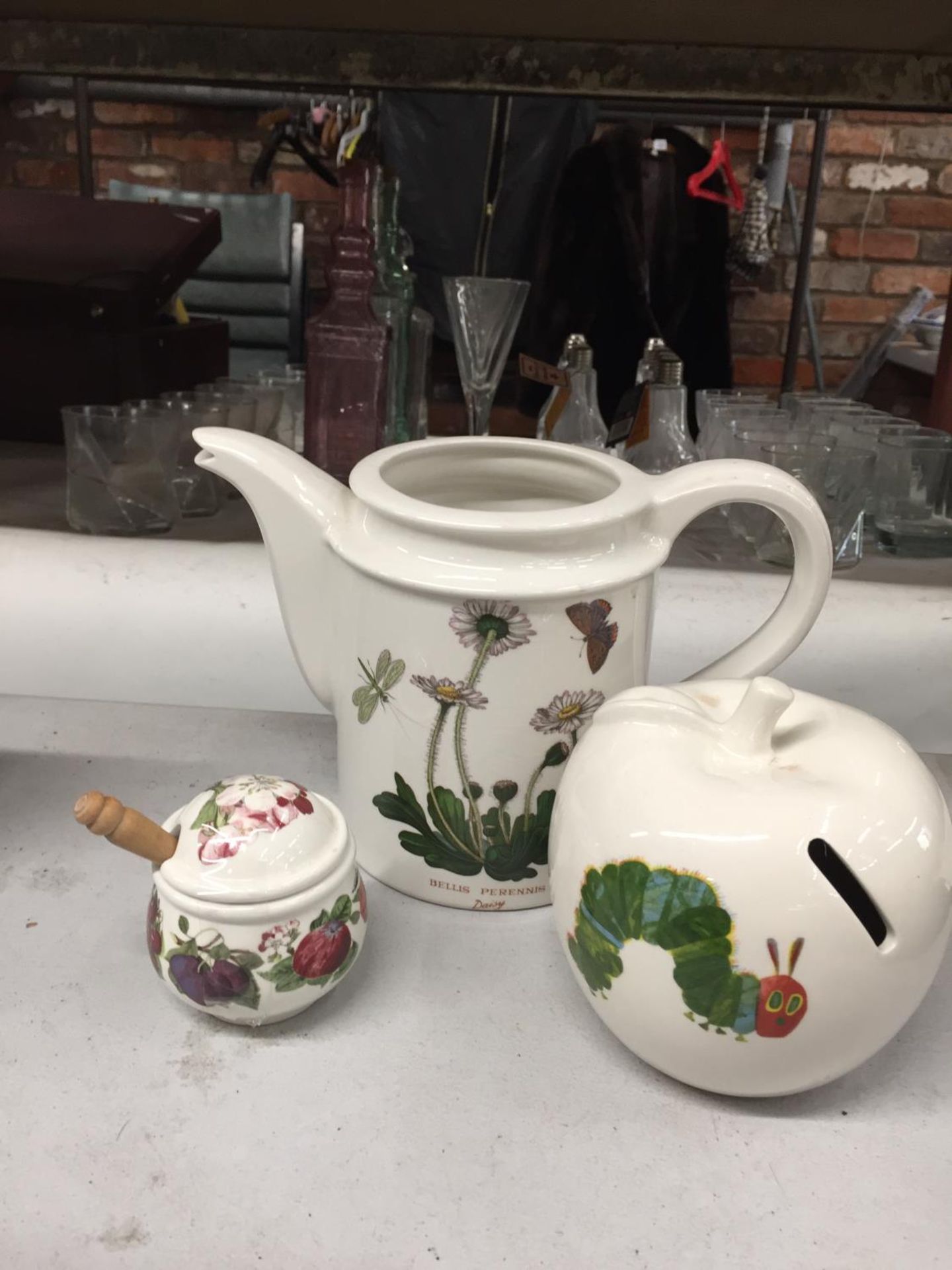 THREE PIECES OF PORTMERION TO INCLUDE A TEAPOT-NO LID- A HUNGRY CATERPILLAR MONEY BOX AND A PRESERVE