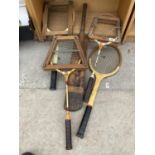 AN ASSORTMENT OF VINTAGE SPORTS EQUIPMENT TO INCLUDE TENNIS RACKETS, BADMINTON RACKETS AND A CRICKET