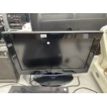 A SAMSUNG 26" TELEVISION WITH REMOTE CONTROL