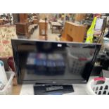 A 37" LG TELEVISION WITH REMOTE CONTROL