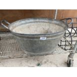 A VINTAGE GALVANISED TIN BATH