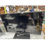 A TOSHIBA 46" TELEVISION WITH REMOTE CONTROL