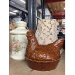 A FLORAL LAMP BASE AND SHADE AND AN EGG CROCK IN THE SHAPE OF A HEN