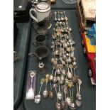 A LARGE QUANTITY OF COLLECTABLE TEA SPOONS, PEWTER AND LIDDED TANKARDS