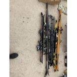 A LARGE ASSORTMENT OF SKIS AND SKI POLES