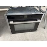 A CHROME AND BLACK NEFF INTERGRATED OVEN