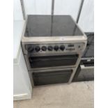 A SILVER HOTPOINT ELECTRIC OVEN AND HOB