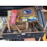 A WOODEN TOOL CHEST CONTAINING AN ASSORTMENT OF TOOLS TO INCLUDE HAMMERS, CHISELS AND PLIERS ETC