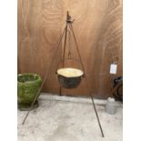A VINTAGE CAST IRON COOKING POT WITH TRIPOD STAND