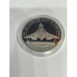 A TEN DOLLAR PROOF COIN OF THE LAST CONCORDE FLIGHT IN A CAPSULE