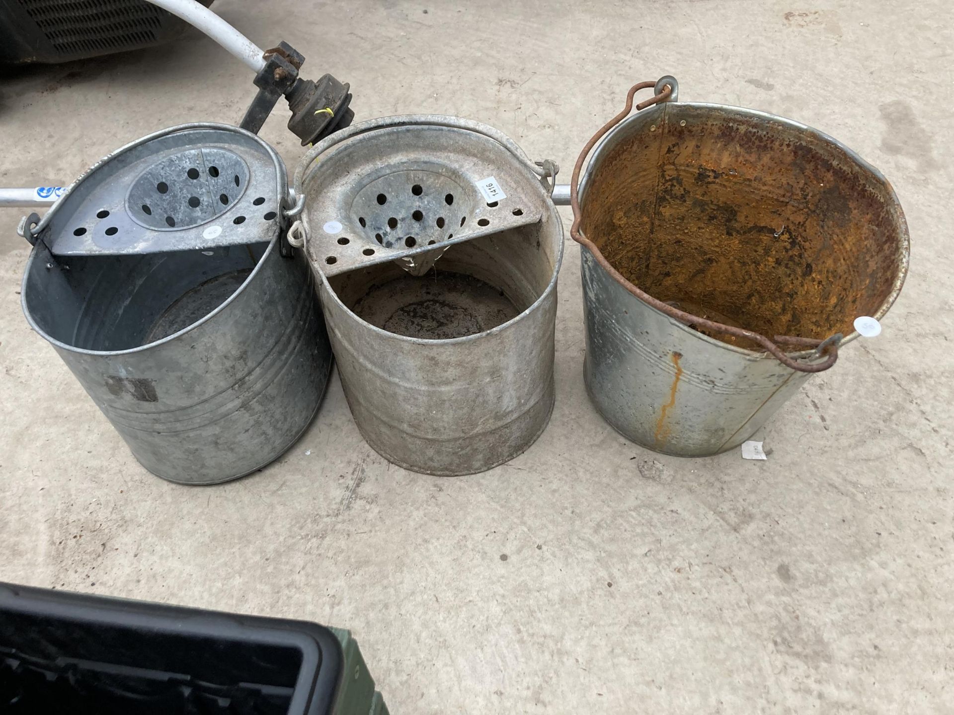 TWO GALVANISED MOP BUCKETS AND A FURTHER BUCKET
