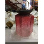 A VINTAGE MOULDE ACID ETCHED CRANBERRY COLOURED CEILING LIGHT SHADE WITH CHAIN HANGING APPROX 25CM X