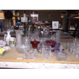 A LARGE QUANTITY OF CLEAR AND COLOURED GLASSWARE TO INCLUDE VASES, BOWLS, JUGS, ETC