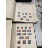 A COLLECTION OF BRITISH COMMONWEALTH STAMPS IN TWO VOLUMES FROM CANADA TO ZANZIBAR