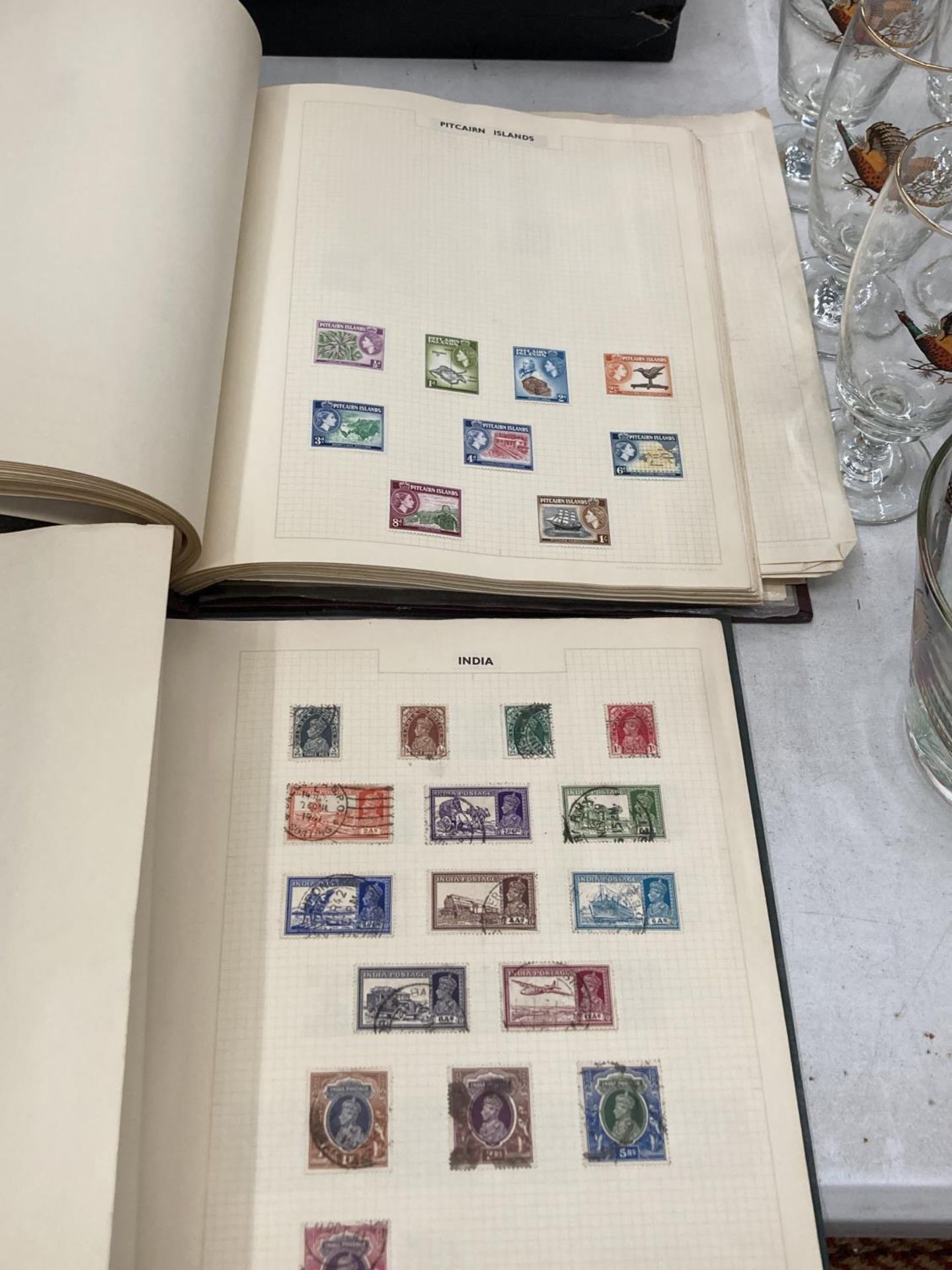 A COLLECTION OF BRITISH COMMONWEALTH STAMPS IN TWO VOLUMES FROM CANADA TO ZANZIBAR
