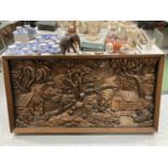 A HARD WOOD, WALL HANGING, VERY HEAVY HAND CARVED DIARAMA OF AN ASIAN VILLAGE SCENE LENGTH 159CM,