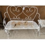 A DECORTIVE WROUGHT IRON GARDEN BENCH