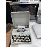 A CASED IMPERIAL TYPEWRITER AND AN HITACHI 19" TELEVISION