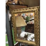 A PLASTIC GILT FRAMED MIRROR 60CM X 54CM